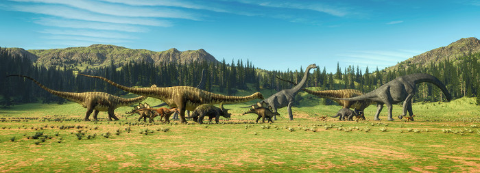 Representação gráfica de várias espécies de dinossauros em um campo aberto.