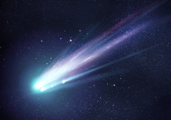 Um cometa brilhante com grandes trilhas de poeira e gás em referência ao cometa Halley.