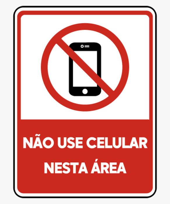 Placa com desenho de um celular e aviso de proibição, exemplo de tipo textual injuntivo.