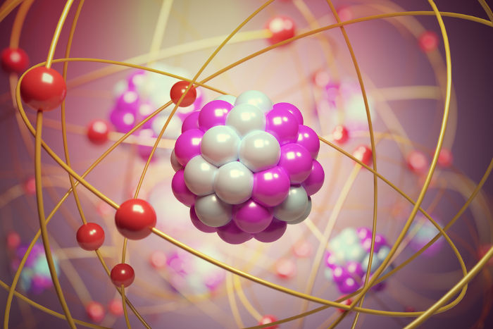 O núcleo atômico é formado pela ligação de dois tipos de partículas quânticas: os prótons e os nêutrons.